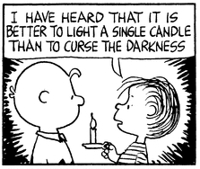 A black-and-white Peanuts comic panel featuring Charlie Brown and Linus. Linus, holding a lit candle on a small plate, speaks to Charlie Brown. He says, 'I have heard that it is better to light a single candle than to curse the darkness.' Charlie Brown listens attentively with a neutral expression.